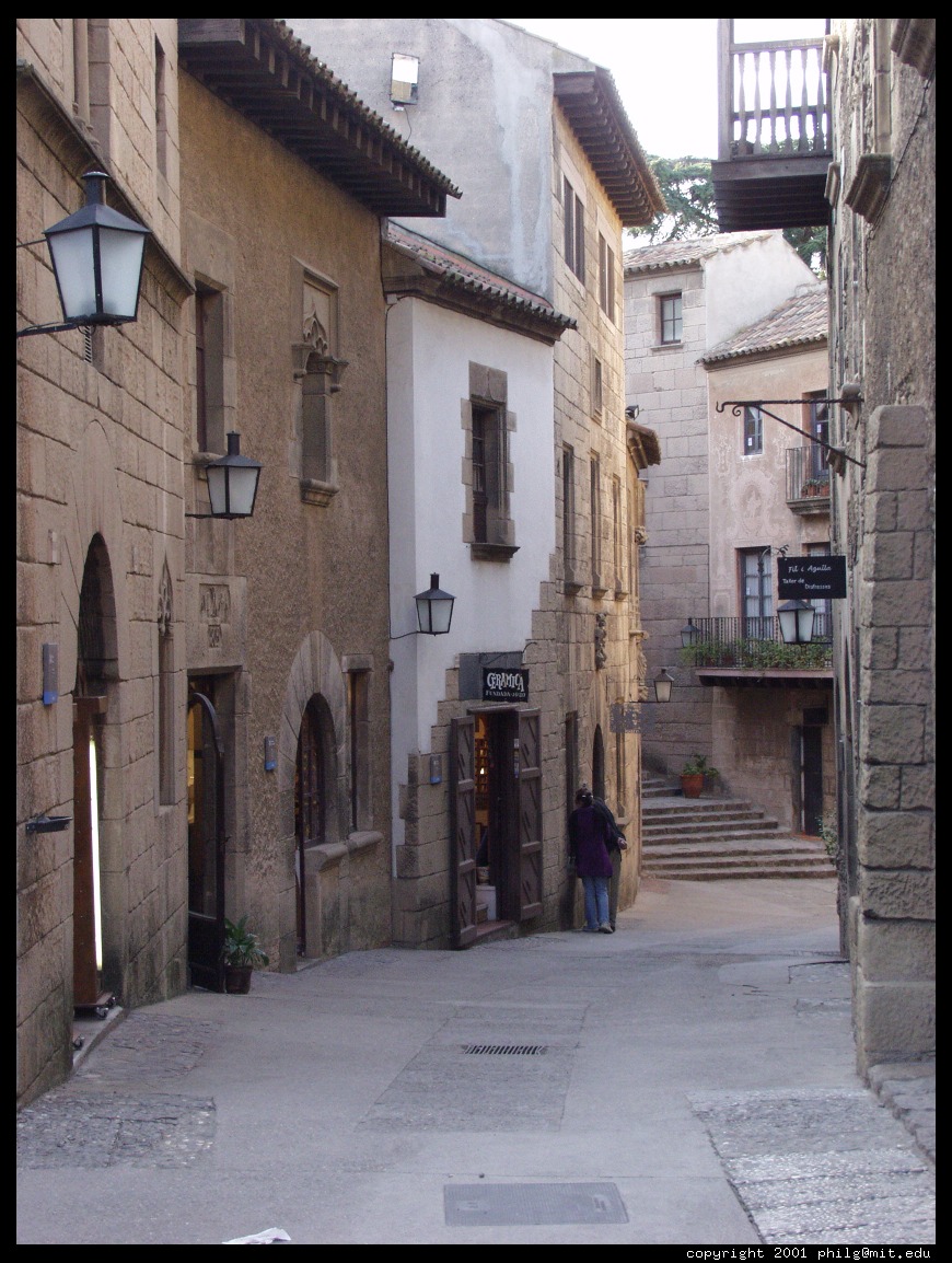 http://philip.greenspun.com/images/200102-e10-barcelona/poble-espanyol-narrow-street.half.jpg