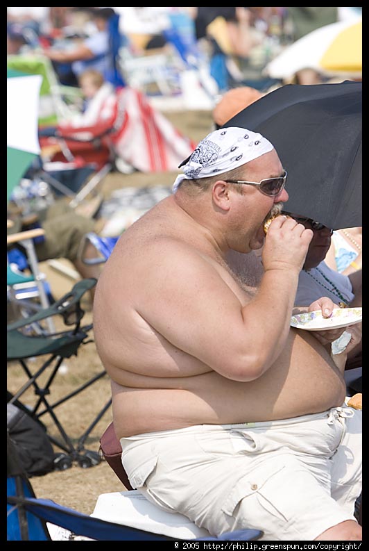 fat boy eating food. fat-shirtless-guy-eating-