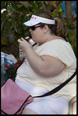 http://philip.greenspun.com/images/20091213-epcot/obese-woman-eating-ice-cream-3.1.jpg