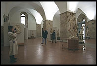 A tourist photographs Michelangelo's Bacchus, inside Florence's Bargello
