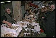 Fishmonger and customers in Venice's Rialto Markets