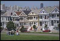 The Painted Ladies Victorian houses of Alamo Square, sometimes referred to as Postcard Row because of the backdrop of downtown skyscrapers.