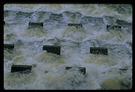 Cooling water flowing out of the Vermont Yankee nuclear power plant and back into the Connecticut River.  These concrete structures are designed to aerate the water and make it more useful to the life of the river.  Vernon, Vermont.