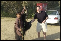 Digital photo titled philip-shaking-hands-with-roadside-bear