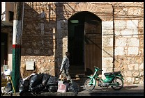 Digital photo titled trash-and-moped