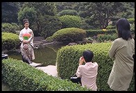 Kimono-clad woman being photographed. New Otani Hotel.  Tokyo