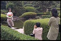 Kimono-clad woman being photographed. New Otani Hotel.  Tokyo