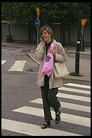 One of many Swedes using a cell-phone in Stockholm