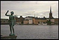 Statue near Stadshuset in Stockholm.  Gamla Stan (Old Town) is in the background.