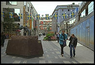 A street for pedestrians in central Stockholm with an anti-violence gun statue