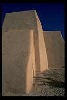 The famous back of the adobe church in Ranchos de Taos.  New Mexico