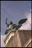 State of the Archangel Michael, atop Castel Sant'Angelo in Rome. This is by the 18th century Flemish sculptor Pieter Verschaffelt. Legend has it that in the year 590, the Archangel Michael appeared above the castle. Now he appears above the castle all day ever day.