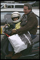 Father and son out Christmas shopping on a moped (Rome)