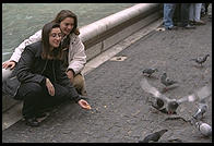 Girls feeding pigeons at the Fontana di Trevi