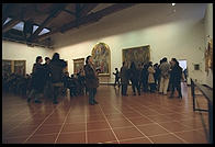 The tour groups at the Uffizi mill about the Botticellis
