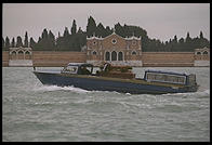 A hearse carries a Venetian to his grave on the lagoon island of San Michele.