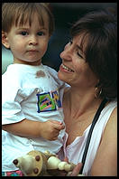 Kid and mom.  Outside French Roast, 6th Avenue and 11th, Manhattan 1995.