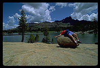 Philip on rock on front of lake in the Sierra Nevada.