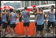 Hosing off after dragon boat racing.  Sha Tin, Hong Kong