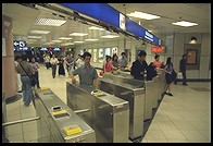 Gates activated by Octopus cards.  Part of mass transit system.  Hong Kong