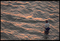 Fishing at sunset. Looking towards Sanibel Island from Fort Meyers, Florida