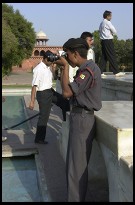 Digital photo titled guard-taking-photo-at-taj-mahal