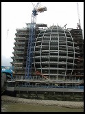 Digital photo titled bulging-oval-building-and-crane